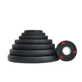 Set of black tri-grip weight plates with a 1.25kg weight plate on white background