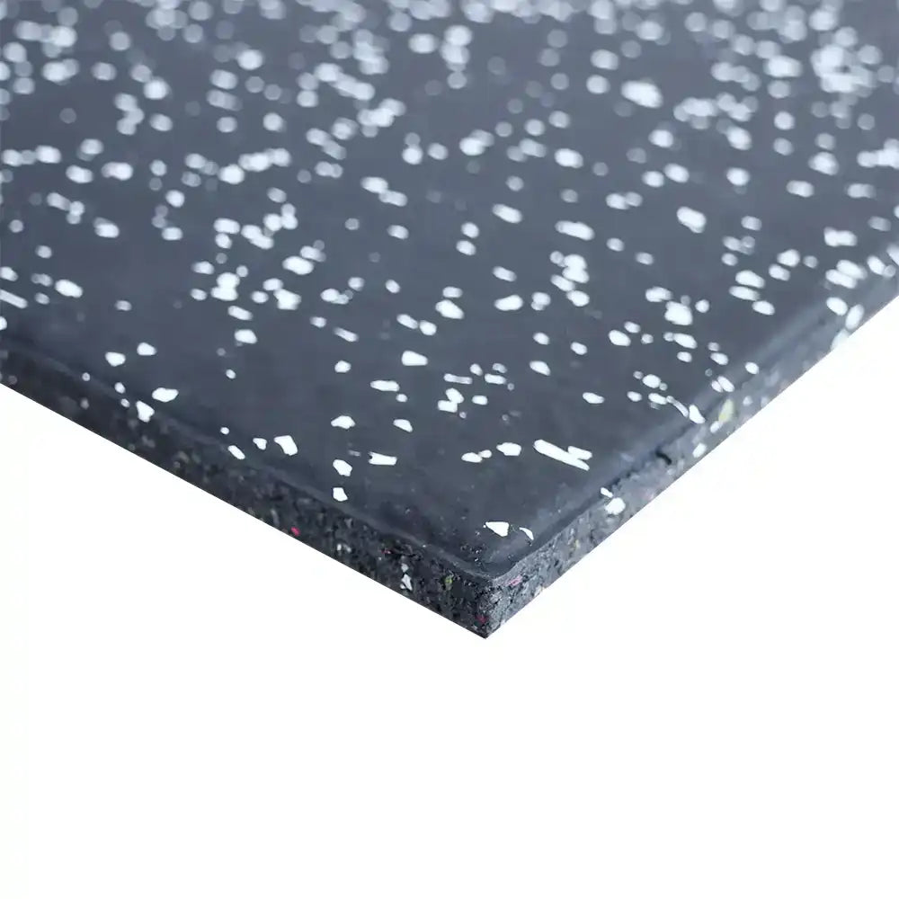 Close-up of a 15mm black rubber mat with white speckles on a white background