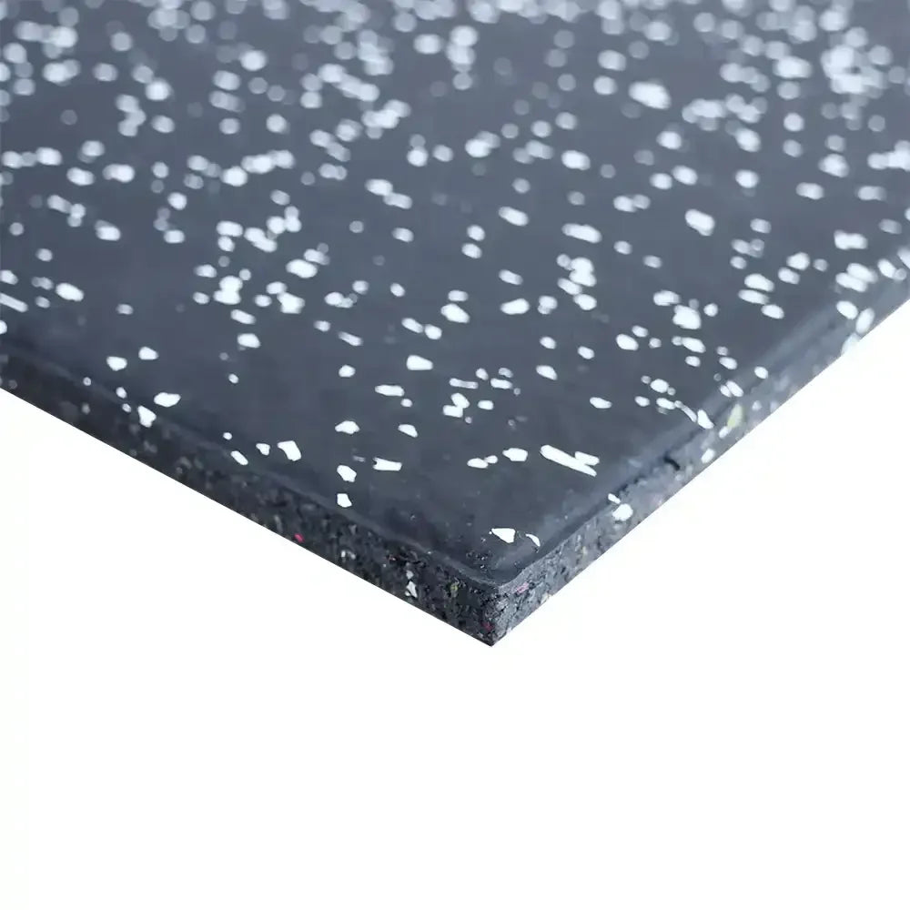 Close-up of a 15mm black rubber mat with white speckles on a white background