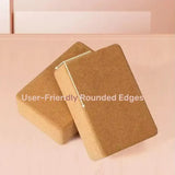 Two cork blocks with rounded edges on a pink background