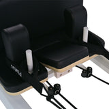 close-up of aluminum pilates reformer headrest and handles