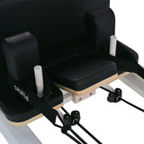 close-up of aluminum pilates reformer headrest and handles