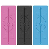 Three yoga mats in pink, black, and blue with a central design.