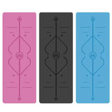 Three yoga mats in pink, black, and blue with a central design.