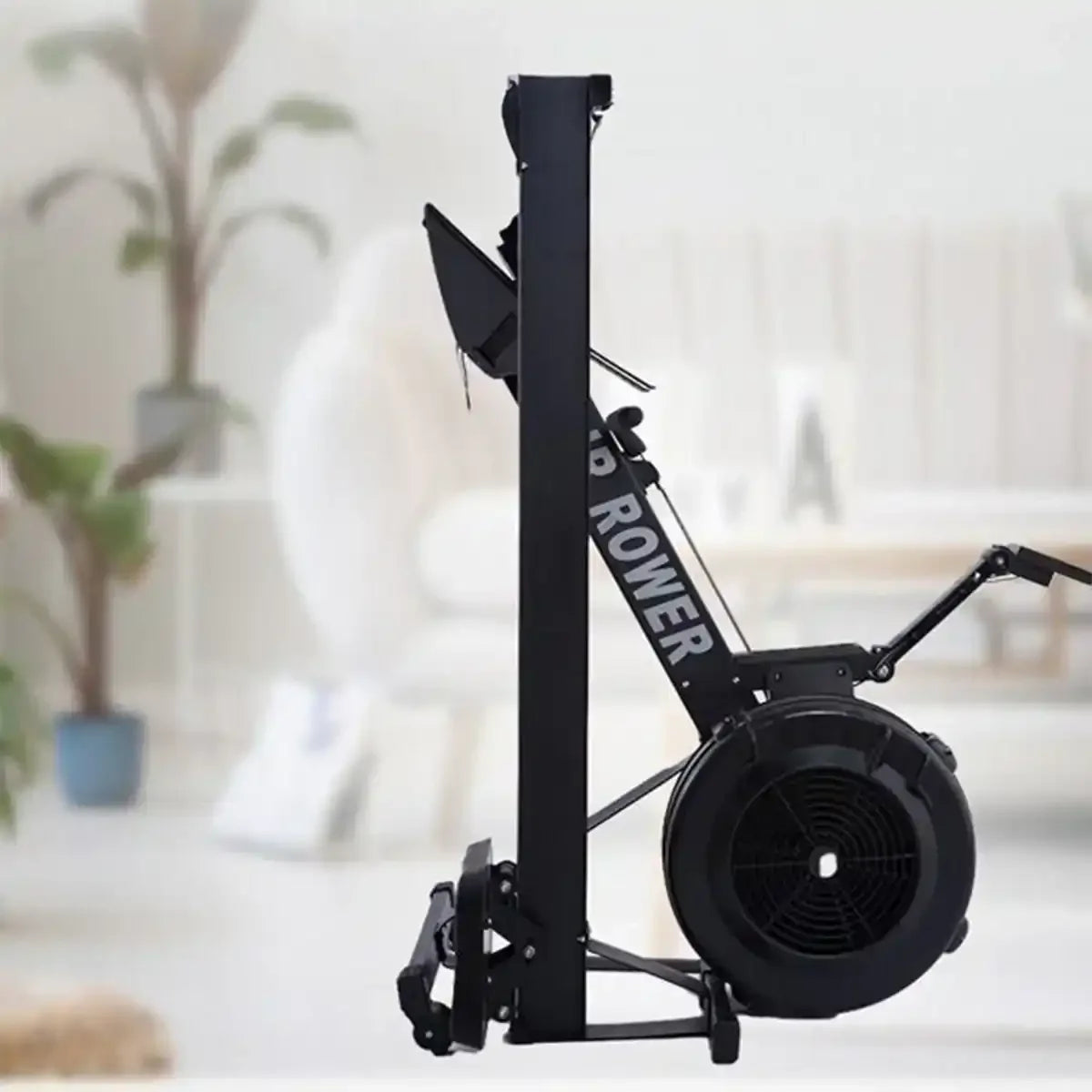 Foldable rowing machine shown upright for home cardio comparison in treadmill vs rowing machine discussion.