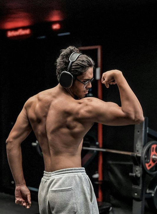 Well-developed rear delts and upper back muscles, commonly targeted by rear delt dumbbell exercises