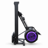 A black indoor rowing machine with a prominent purple fan housing and white 'AIR ROWER' branding, shown on a clean white background.