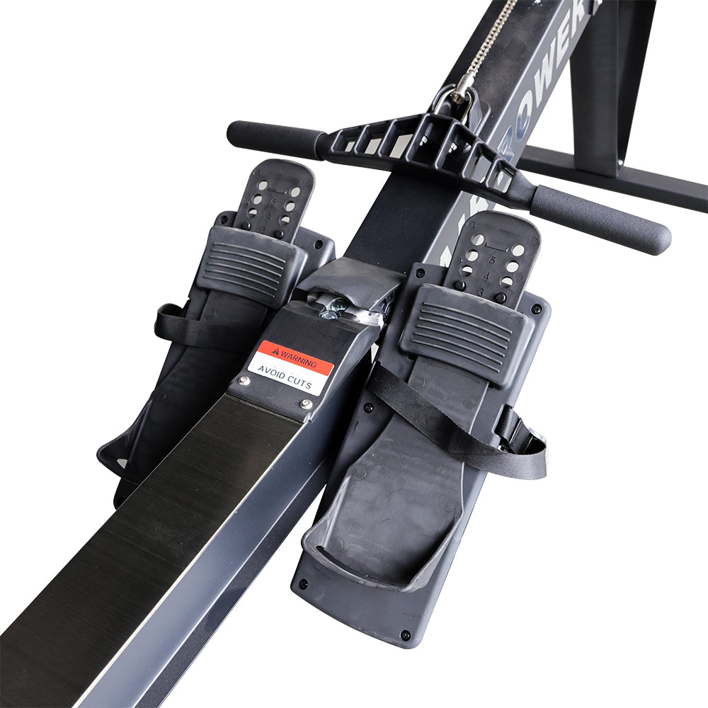Close-up of a magnetic air rowing machine's foot straps