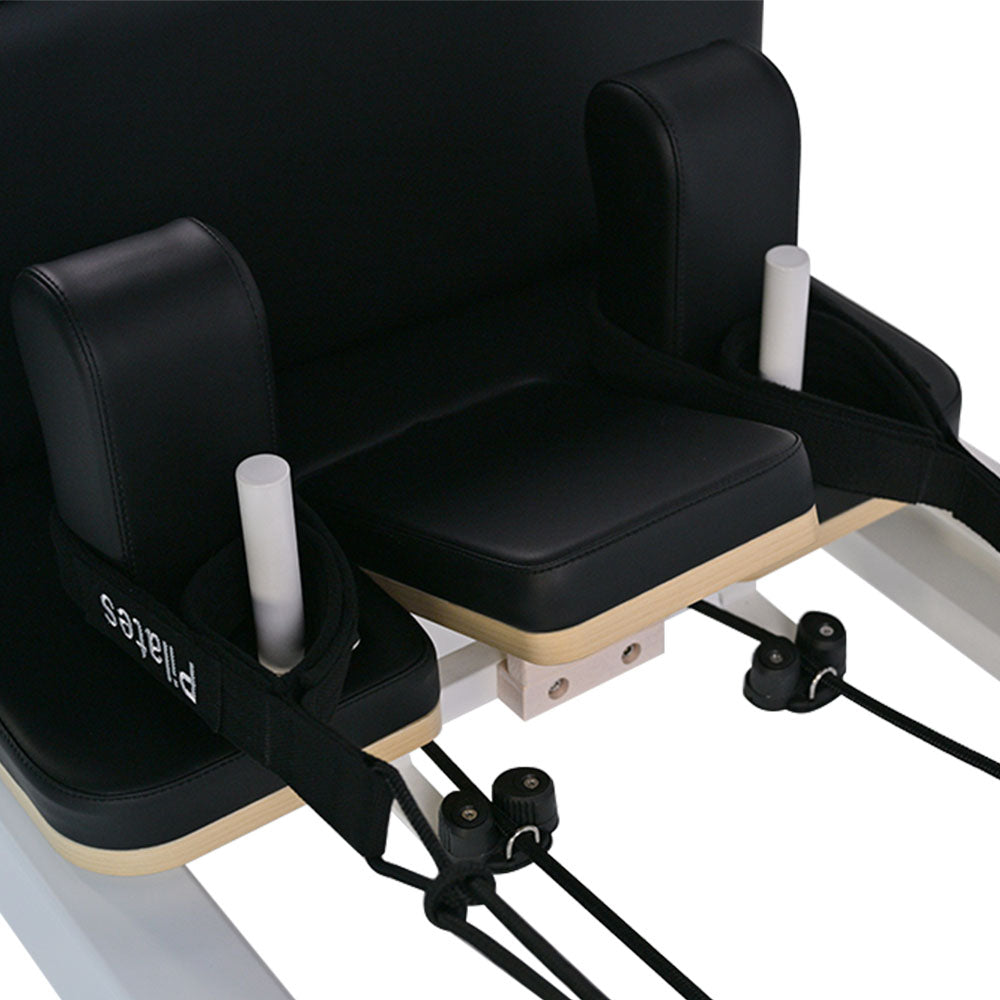 close-up of aluminum pilates reformer headrest and handles