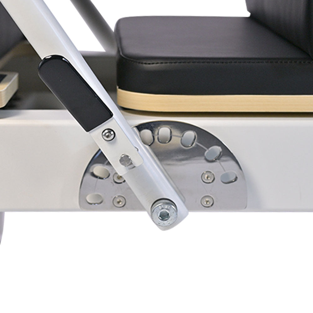 close-up of aluminum pilates reformer foot-bar adjustment bracket