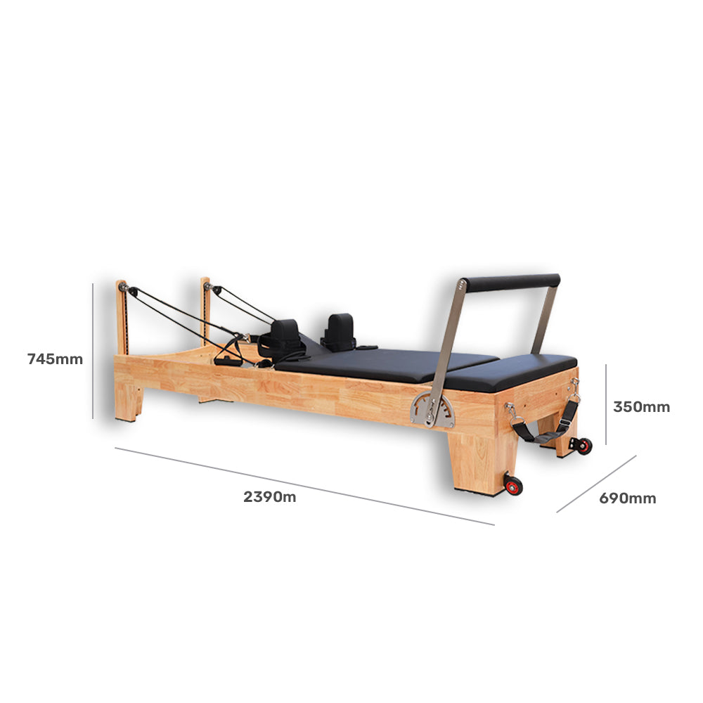 Wooden Pilates reformer with dimensions labelled on a white background