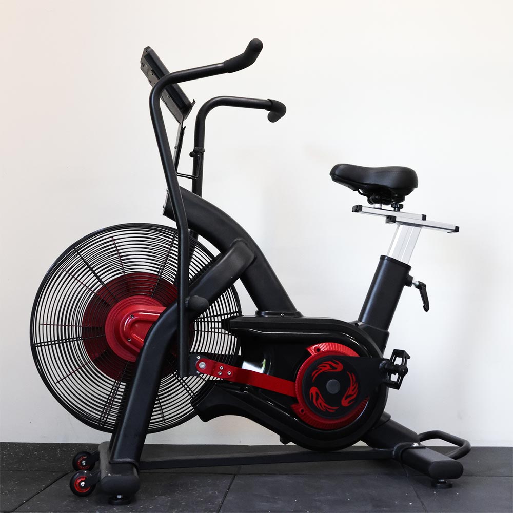 Black and red exercise bike with fan on a white background
