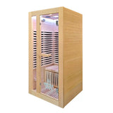 A wooden infrared sauna cabin with a light natural wood exterior, glass door, interior wooden shelves, and a visible LED light at the top, shown on a plain white background.