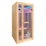 A single-pane infrared sauna cabin made of light natural wood with a glass door, interior LED lighting, and a visible INERA LIVE logo on the lower right side of the door.