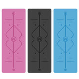 Three yoga mats in pink, black, and blue with a central design.