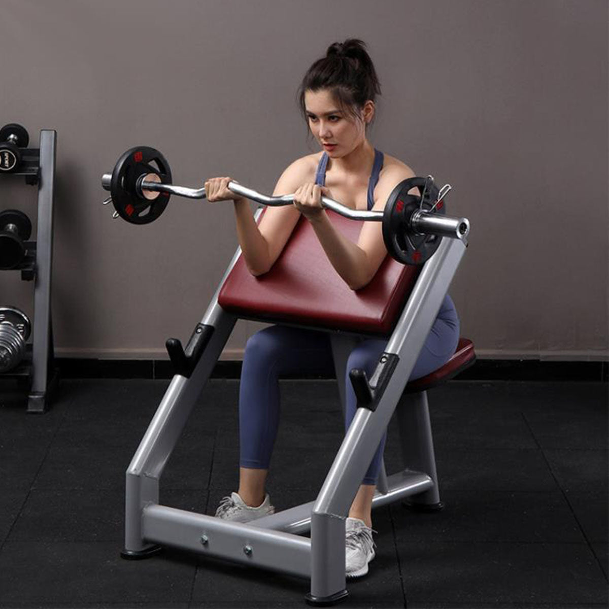 female model on Commercial Preacher Curl Biceps Training Bench